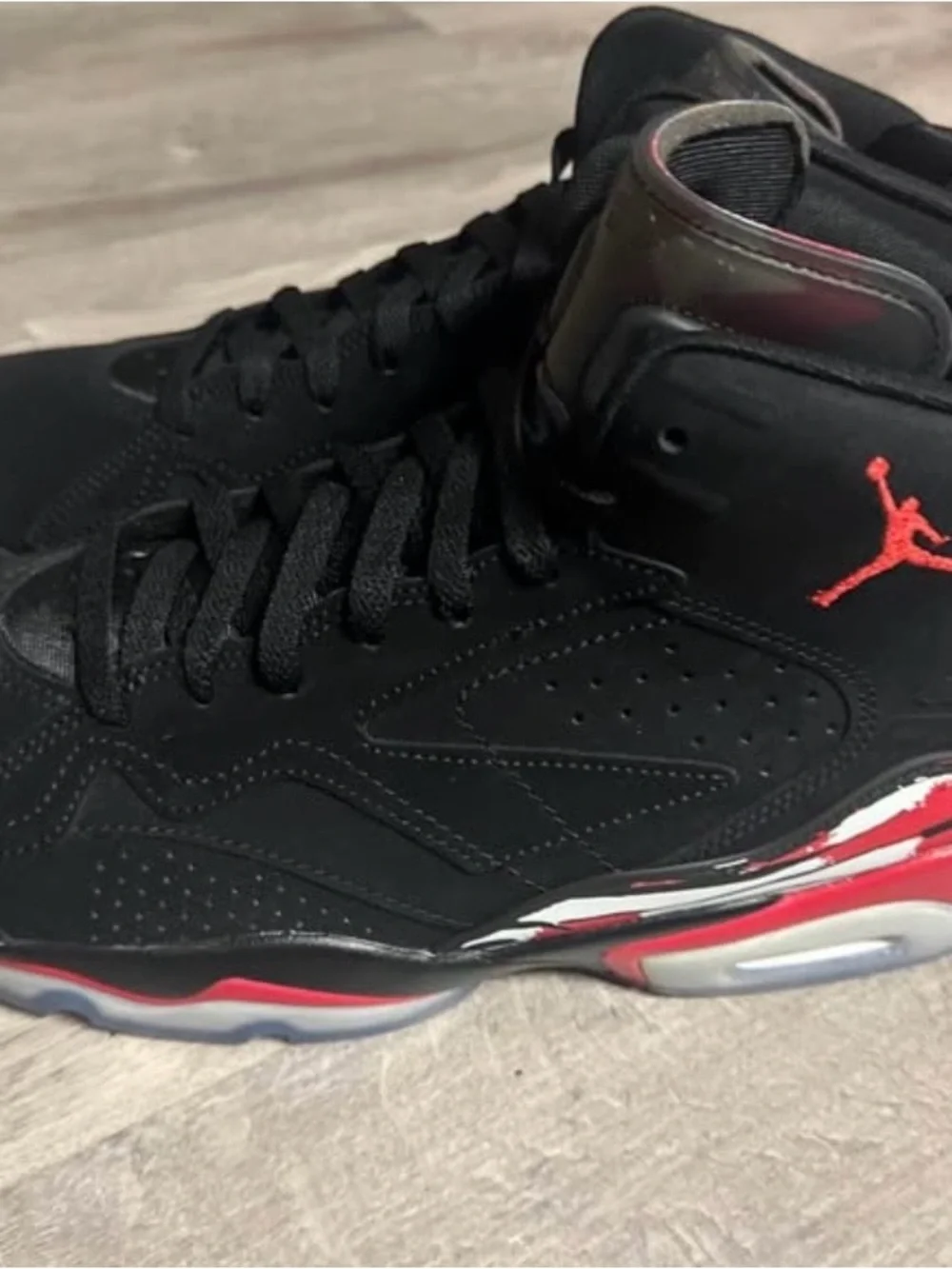 Jordan Black High-Top Sneakers with Red Heel Pull